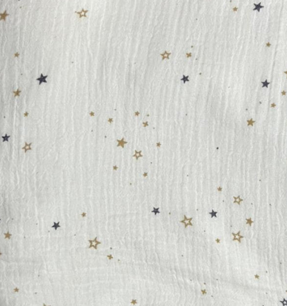 White fabric with star patterns on a purple background