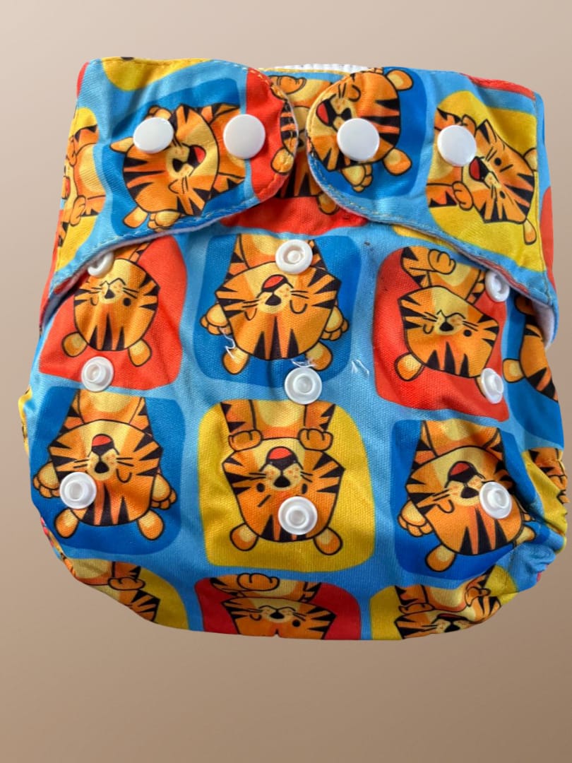Reusable diaper with tiger pattern on a beige background