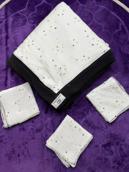 Set of white handkerchiefs with black borders on a purple textured fabric background